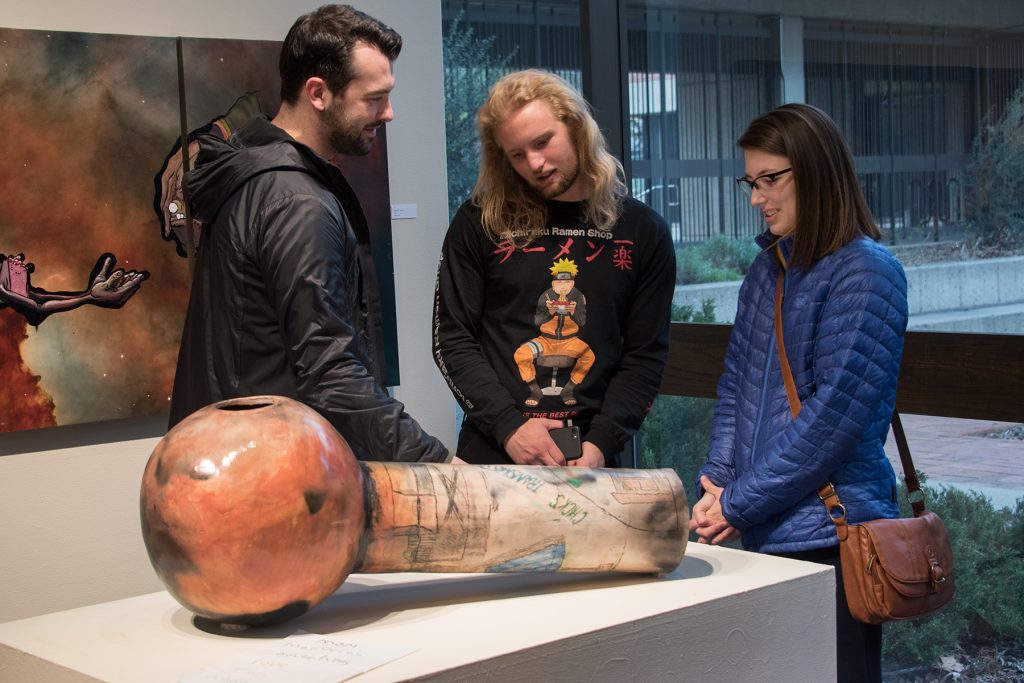 Annual Student Exhibition, 2018: Opening Reception; artwork by Nemo Miller (foreground) and Enrique Ortega (background)